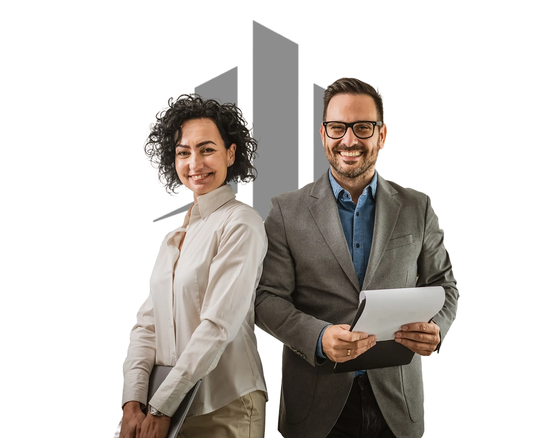Two professionals smiling, holding documents, standing side by side.